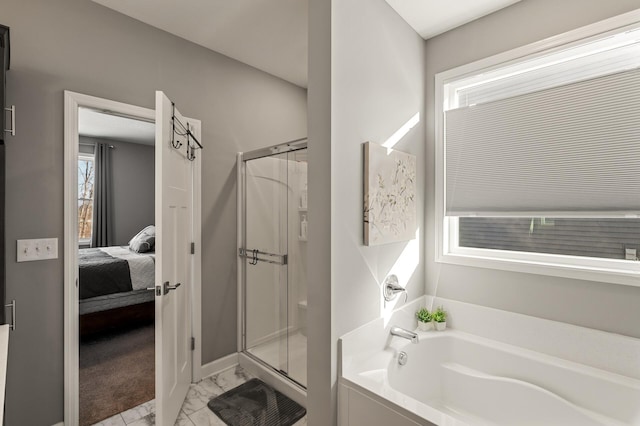 bathroom with separate shower and tub