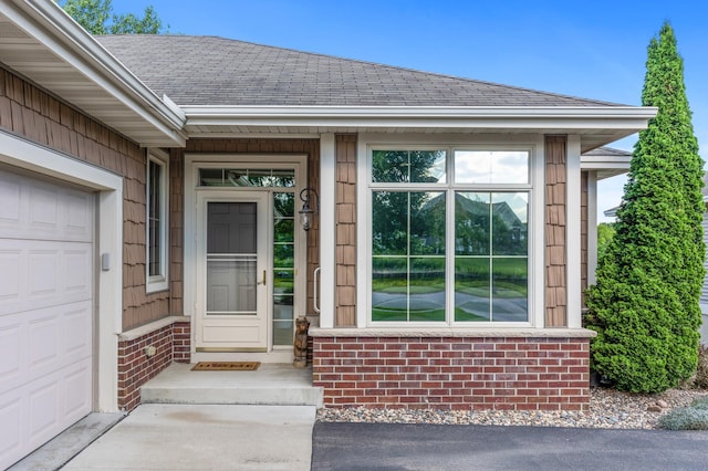 doorway to property featuring a garage