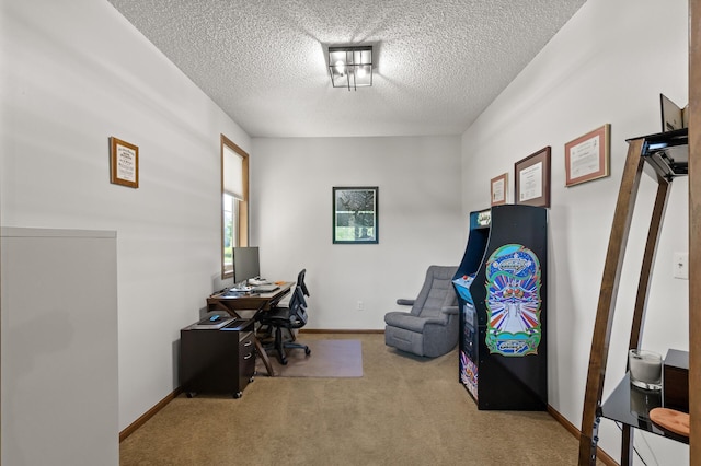 office featuring a textured ceiling and light carpet