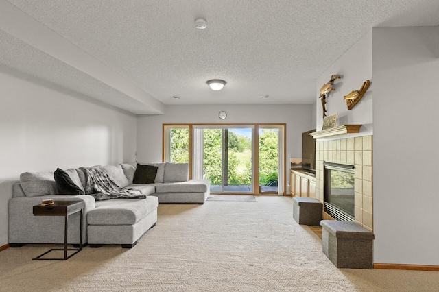 living room featuring carpet, a textured ceiling, and a fireplace