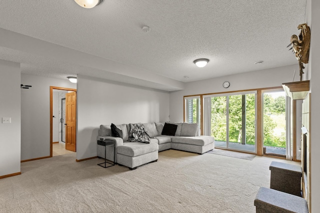 living room with a textured ceiling and light carpet