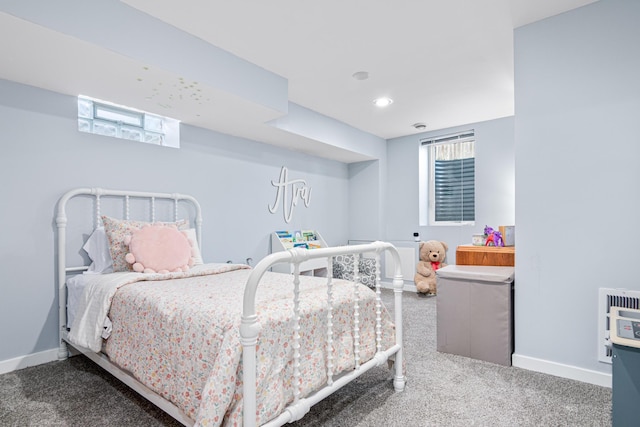 carpeted bedroom featuring baseboards, recessed lighting, and heating unit