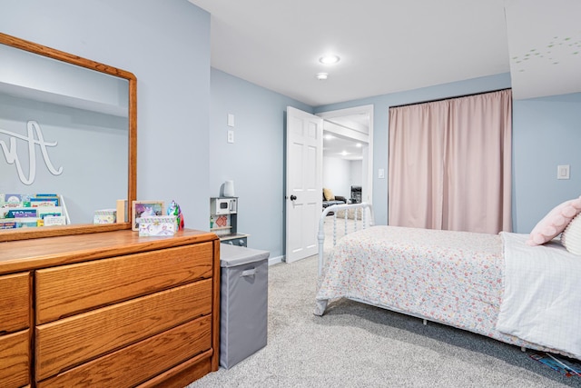 bedroom with light carpet, recessed lighting, and baseboards