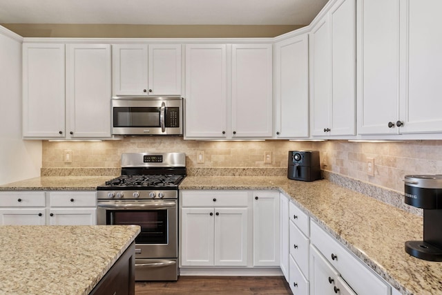 8160 Virginia Ln, Savage, MN 55378 - kitchen featuring appliances with stainless steel finishes and white cabinetry