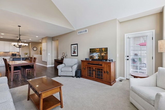 8160 Virginia Ln, Savage, MN 55378 - living room with recessed lighting, a chandelier, vaulted ceiling, and wood finished floors