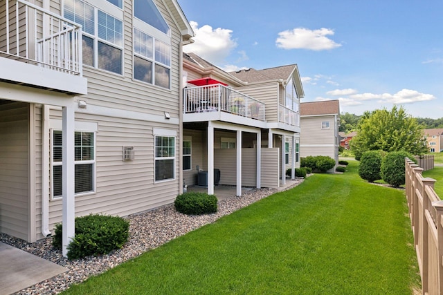 8160 Virginia Ln, Savage, MN 55378 - view of grassy yard with a patio area and a balcony