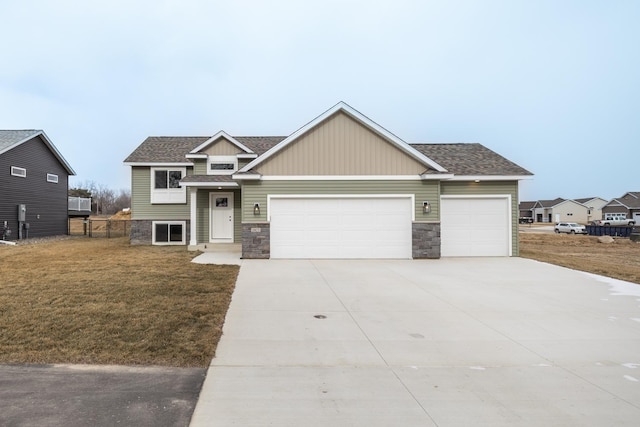 view of front facade with a front yard and a garage