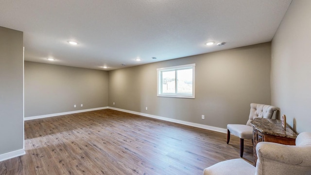 unfurnished room with light wood-type flooring