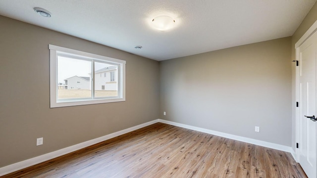 unfurnished room featuring light wood-type flooring