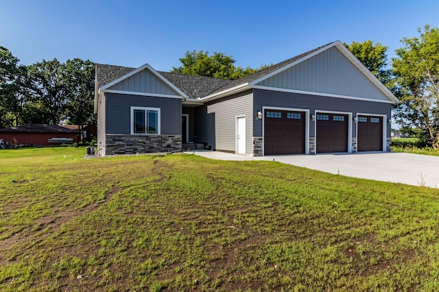 craftsman-style home with a garage and a front yard