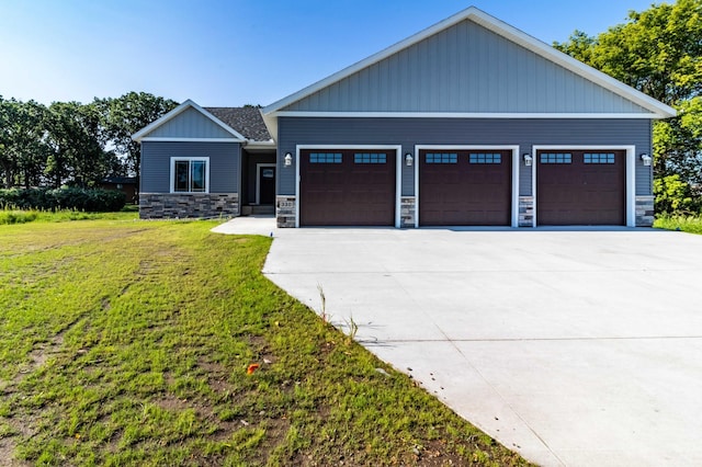 craftsman-style home with a garage and a front yard