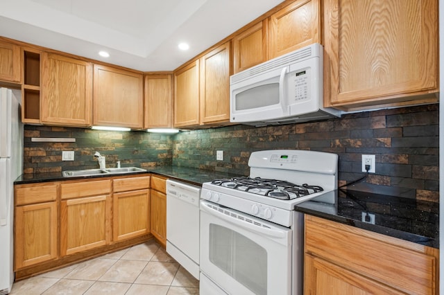 kitchen featuring backsplash, white appliances, sink, and light tile patterned floors