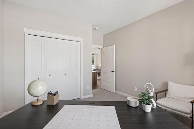 living area with carpet flooring and baseboards