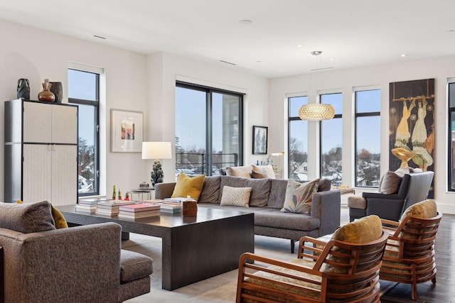 living room with plenty of natural light and light wood-type flooring