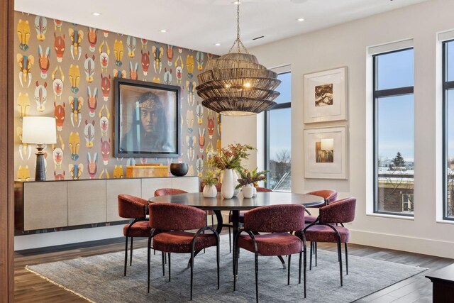 dining area featuring a notable chandelier and dark hardwood / wood-style floors