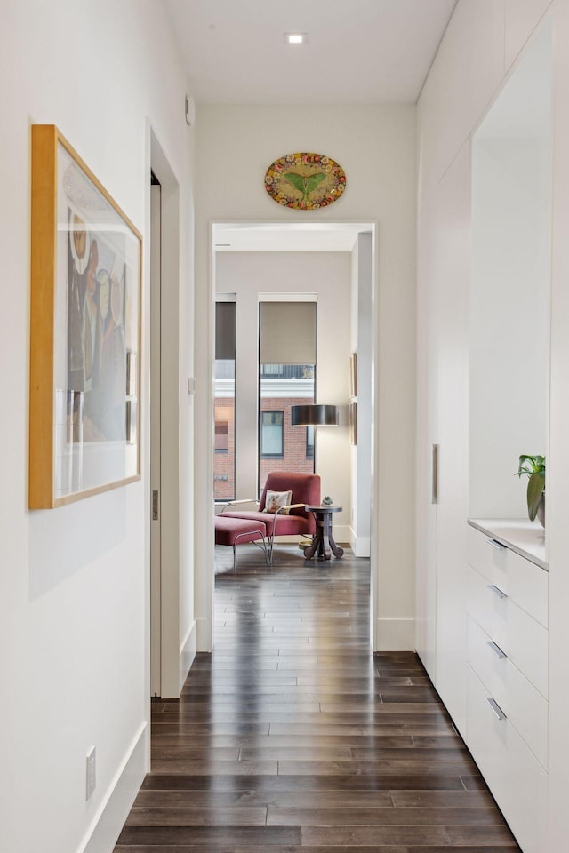 corridor with dark hardwood / wood-style floors