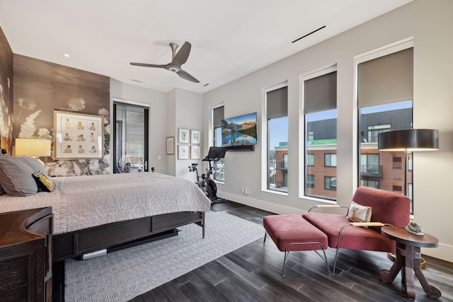 bedroom with dark wood-type flooring and ceiling fan