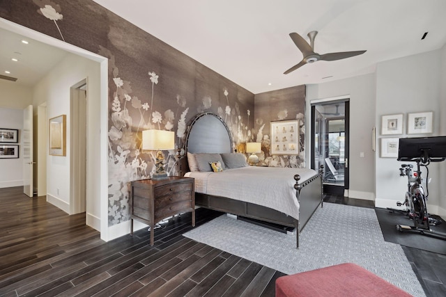 bedroom with dark hardwood / wood-style flooring and ceiling fan