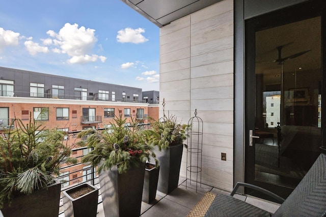 balcony featuring ceiling fan