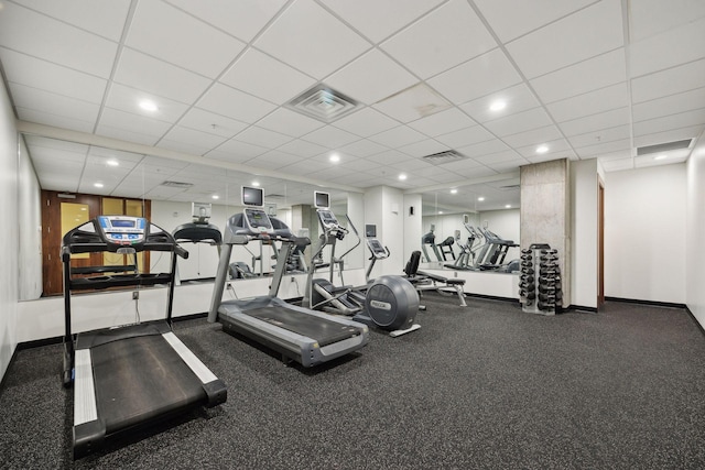 workout area with a paneled ceiling