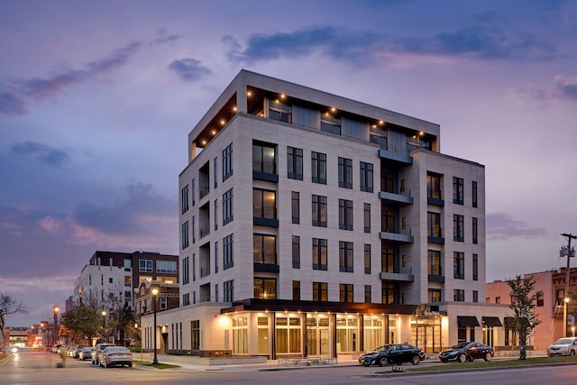 view of outdoor building at dusk