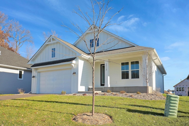 view of front of home featuring a porch, a garage, and a front yard