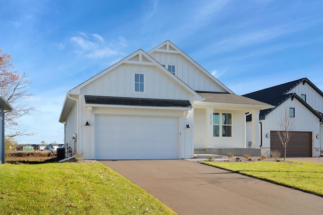 13104 Ghia Ct NE, Blaine, MN 55449 - modern inspired farmhouse featuring board and batten siding, a front lawn, driveway, and central AC unit