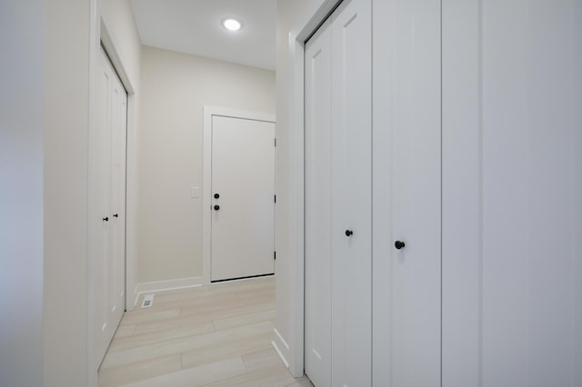 13104 Ghia Ct NE, Blaine, MN 55449 - hall with baseboards, recessed lighting, and light wood finished floors