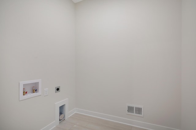 13104 Ghia Ct NE, Blaine, MN 55449 - laundry area with hookup for an electric dryer, baseboards, and hookup for a washing machine