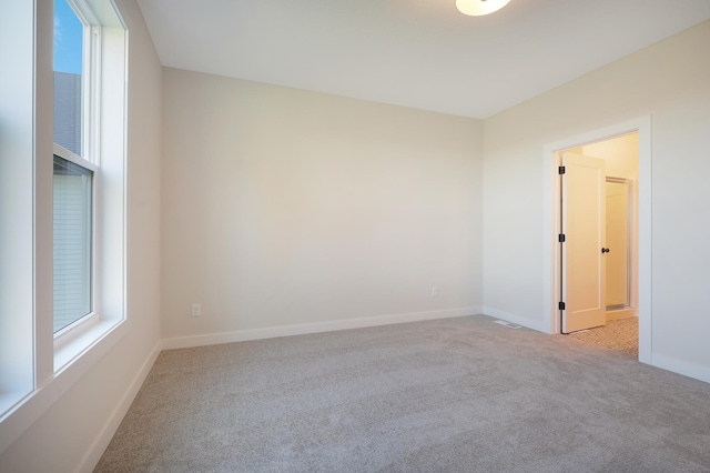 13104 Ghia Ct NE, Blaine, MN 55449 - carpeted empty room with baseboards