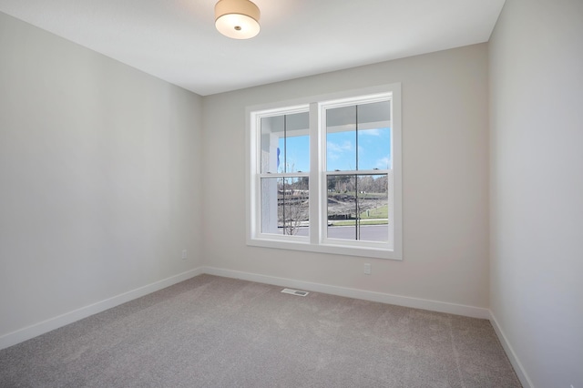 13104 Ghia Ct NE, Blaine, MN 55449 - unfurnished room featuring light colored carpet and baseboards