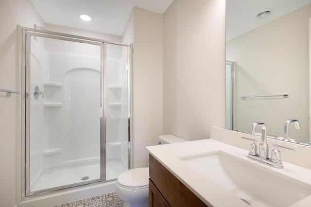 13104 Ghia Ct NE, Blaine, MN 55449 - full bathroom featuring toilet, a stall shower, vanity, and recessed lighting