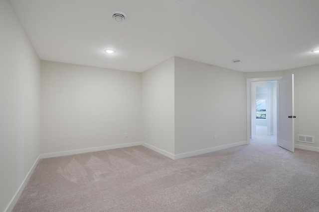 13104 Ghia Ct NE, Blaine, MN 55449 - unfurnished room with light colored carpet, baseboards, and recessed lighting