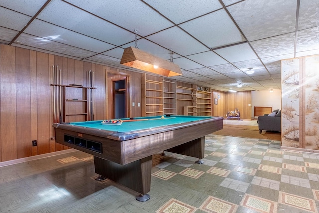game room featuring wood walls, tile patterned floors, a paneled ceiling, and pool table