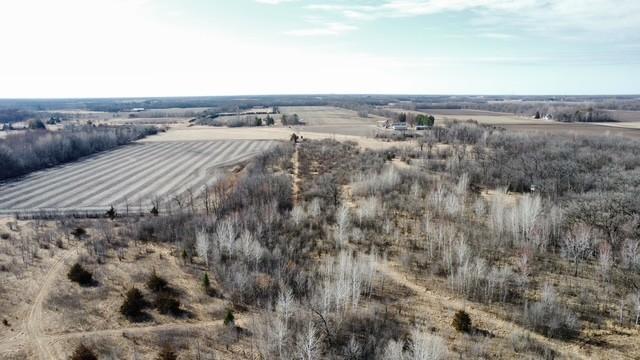 birds eye view of property with a rural view