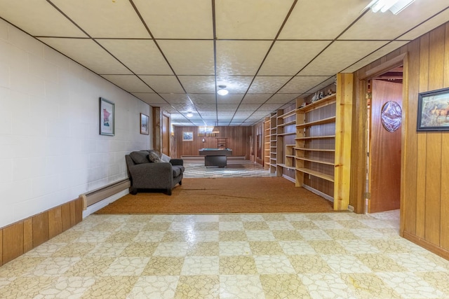 interior space with wood walls, billiards, a paneled ceiling, and baseboard heating