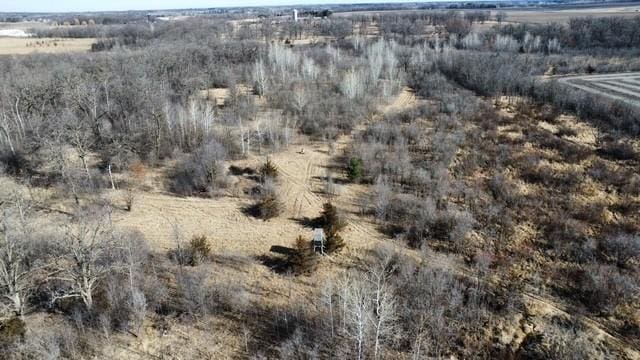 birds eye view of property with a rural view