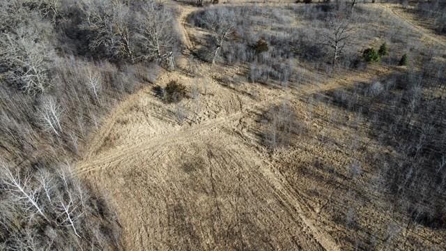 birds eye view of property featuring a rural view