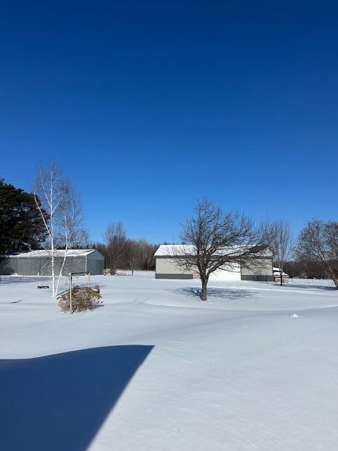 view of yard covered in snow
