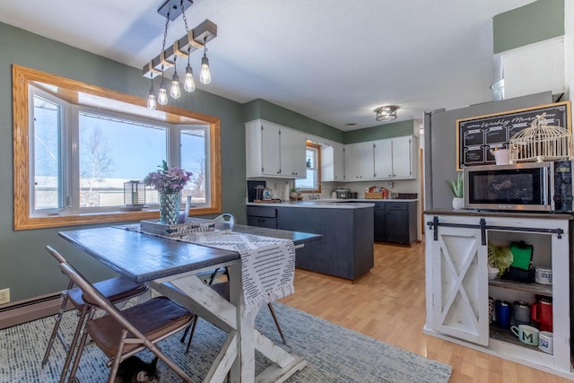 13959 55th St NE, Foley, MN 56329 - dining area with light wood finished floors