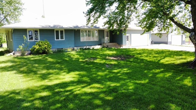 13959 55th St NE, Foley, MN 56329 - ranch-style home featuring a garage, driveway, and a front yard