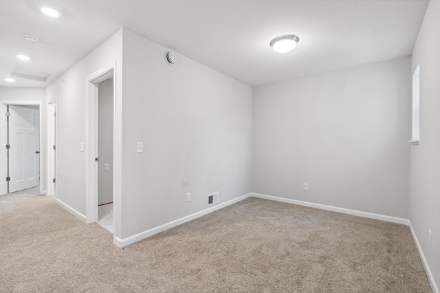 unfurnished room featuring recessed lighting, visible vents, baseboards, and carpet flooring