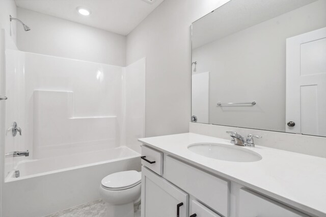 bathroom with toilet, vanity, and shower / bathing tub combination