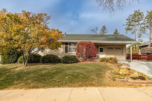 view of front of house with a garage and a front yard