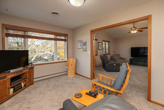 carpeted living room with ceiling fan, baseboard heating, a textured ceiling, and lofted ceiling