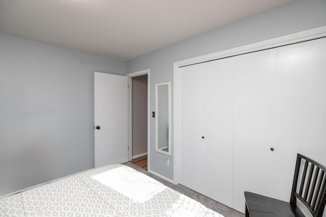 carpeted bedroom with a closet