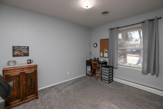 misc room with dark carpet, a baseboard heating unit, and a textured ceiling