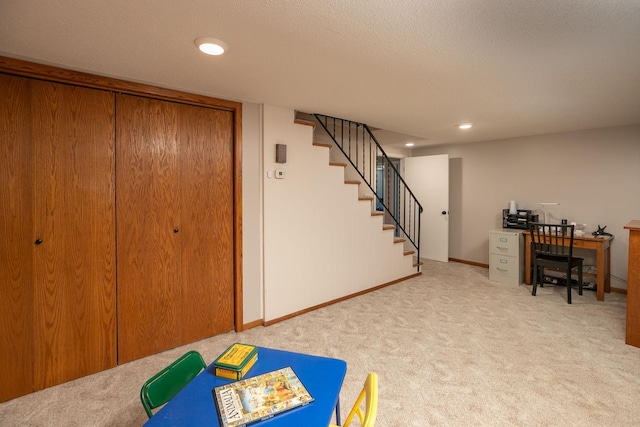 basement featuring light carpet