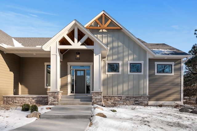 view of snow covered property entrance