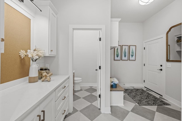 bathroom featuring toilet and vanity